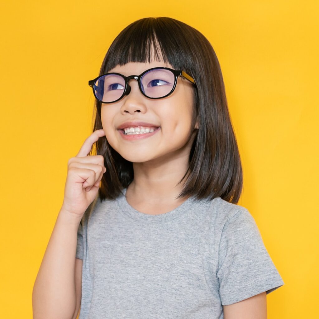 Vibrant child beaming after finishing early orthodontic treatment in Minnesota